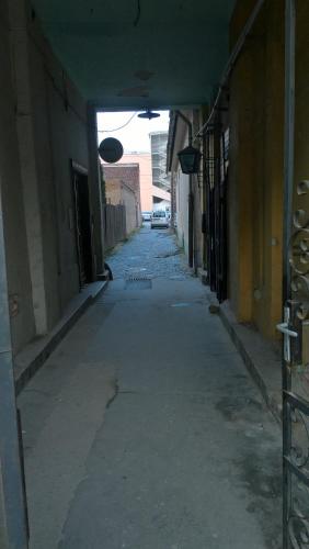 an empty alley way in an old building at Széchenyi Apartman Miskolc belvárosban in Miskolc