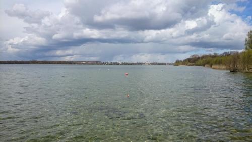 a large body of water under a cloudy sky at Idyll im Land der 1000 Seen in Liessow
