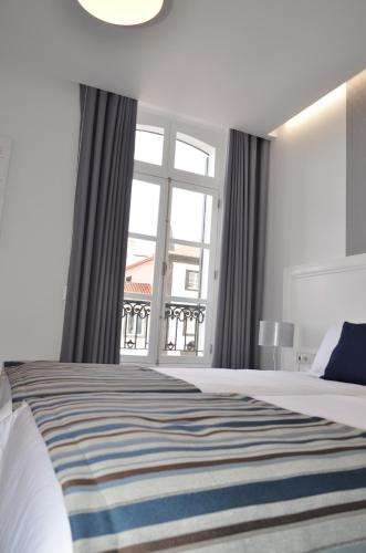 Postel nebo postele na pokoji v ubytování Edificio Charles 201