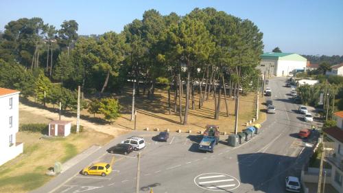 an aerial view of a street with cars on the road at Apartamentos Rúa Virxe do Carme in Sanxenxo