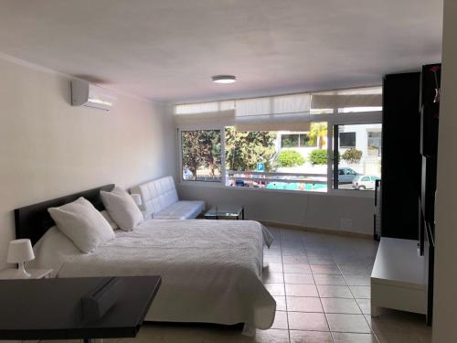 Postel nebo postele na pokoji v ubytování Studio Los Cristianos Beach