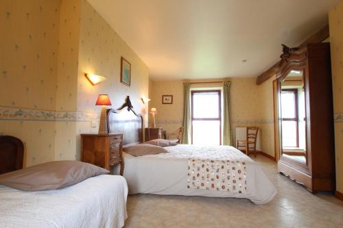 Postel nebo postele na pokoji v ubytování Le Petit Manoir - Jean Gédouin