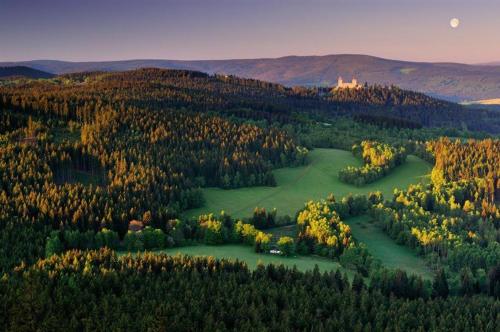 an aerial view of a golf course with a castle at Apartmán "Pod Rokem" in Sušice
