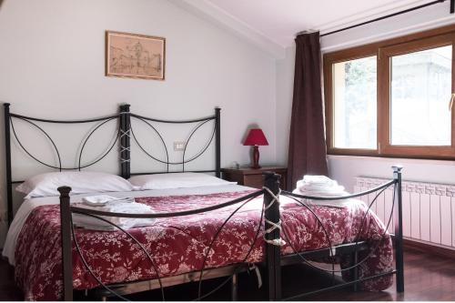 Säng eller sängar i ett rum på Il Mulino