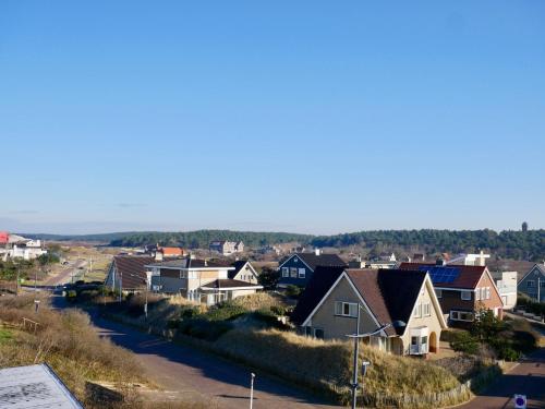 a small town with houses and a road at Appartementen de Strandloper in Bergen aan Zee