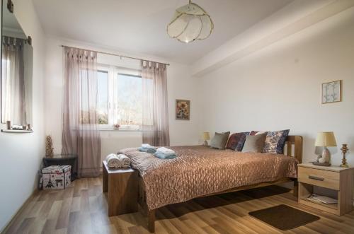 a bedroom with a bed and a window at Apartment 10 Visoko in Visoko