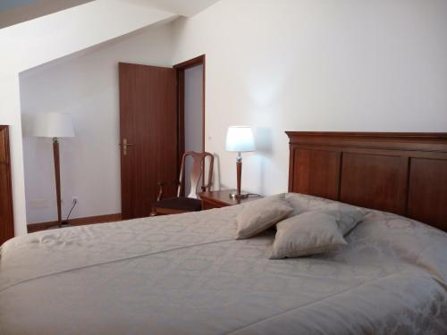 Katil atau katil-katil dalam bilik di Janelas da Praia