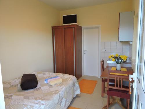 Postel nebo postele na pokoji v ubytování Apartments Frakić