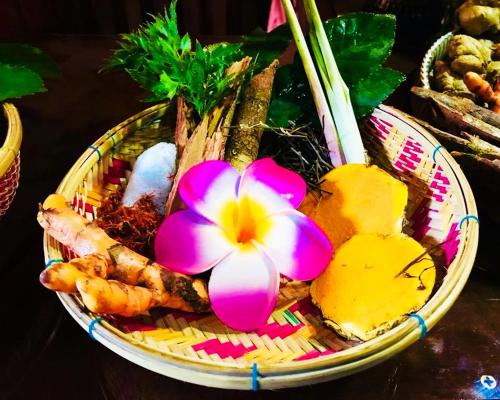 a basket of food with a flower on it at Hello Cambodia Boutique in Siem Reap