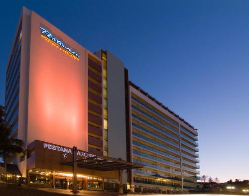 a large building with a large sign in front of it at Pestana Carlton Madeira Ocean Resort Hotel in Funchal