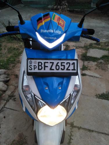 a motorcycle with a license plate on the back at Pitaramba Lodge in Bentota