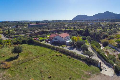 an aerial view of a house in a field at Olive Private Villa Swimming Pool 5 BDR Kolymbia Rhodes in Kolimbia