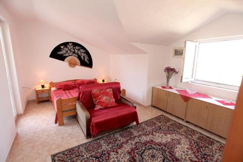 a bedroom with two beds and a window at Vila Nataly in Trogir