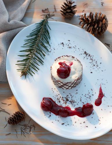 a white plate with a cake on a table at Landhaus Lauble in Hornberg