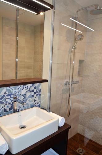 a bathroom with a sink and a shower at Castel Damandre - Demeures & Châteaux in Arbois