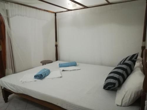 Postel nebo postele na pokoji v ubytování Hotel Sandara