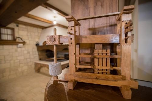 a model of a wooden house on a table at Mistral Apartments in Lopar