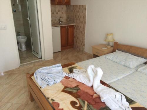 Cama o camas de una habitación en Sand and Sea Apartments