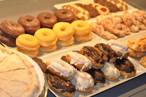 
a display case filled with lots of different types of donuts at Hotel Selu in Córdoba
