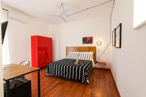A bed or beds in a room at Travel B&B