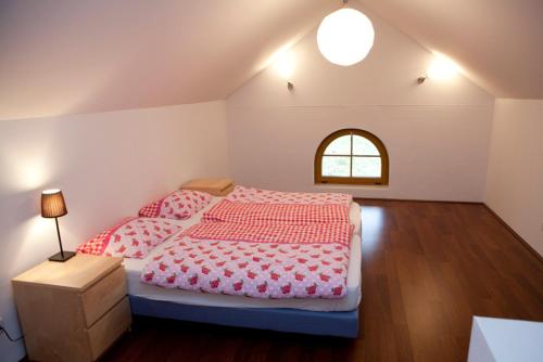 a bedroom with two beds and a window at Steuer 59 App 6 Annaberg in Annaberg im Lammertal