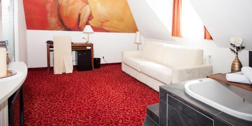 Postel nebo postele na pokoji v ubytování Hotel Gramaser