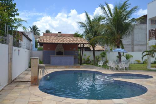 The swimming pool at or close to Apartamento em Barra do Cunhaú