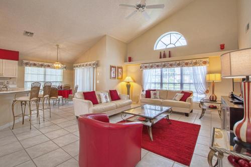 a living room with a couch and a table at Mickey's Lake Villa in Orlando