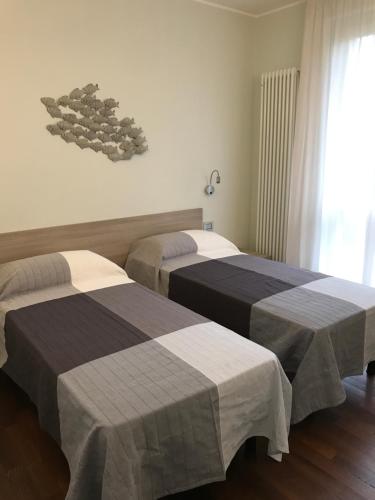 En eller flere senge i et værelse på Appartamento rosmarino