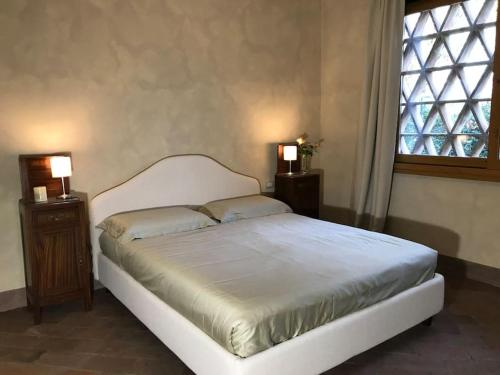 En eller flere senger på et rom på Villa Leonardo