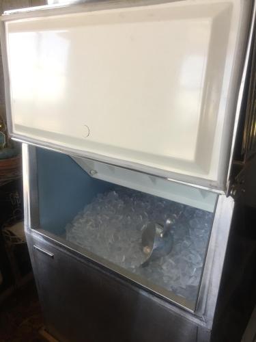 an open refrigerator filled with lots of ice at Rustic Motel Rolla in Rolla