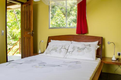 
Uma cama ou camas num quarto em Pousada VillaBahia
