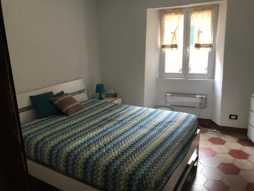 A bed or beds in a room at Appartamenti La Quiete