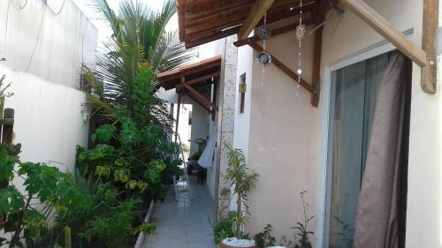 a hallway of a house with a bunch of plants at Apt Penedo in Penedo