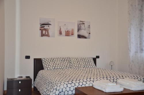 a bedroom with a bed with two towels on a table at Old Factory in Omegna
