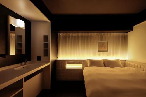 Cama o camas de una habitación en Third Place Hotel