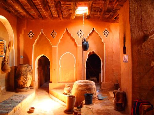 a room with a building with a room with at Riad Al Anwar in Tinerhir