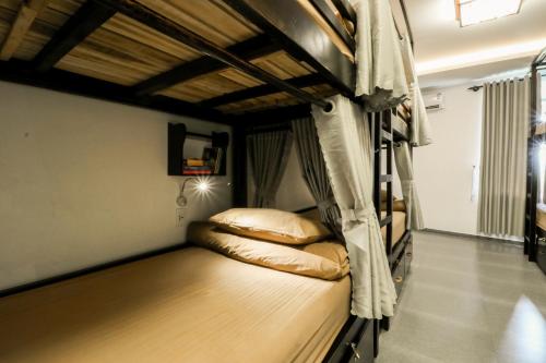 a bedroom with two bunk beds in a room at Phu House in Phu Quoc