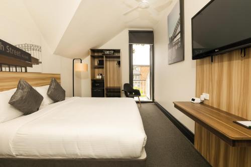 מיטה או מיטות בחדר ב-Glenferrie Lodge