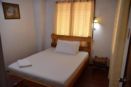 Ein Bett oder Betten in einem Zimmer der Unterkunft Roy's Rendezvous Boracay