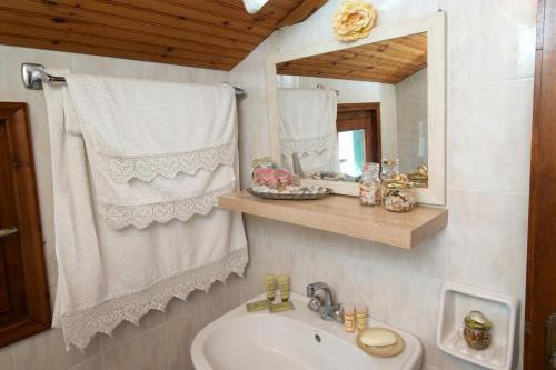 a bathroom with a sink and a mirror at Alkmini Studio in Minia