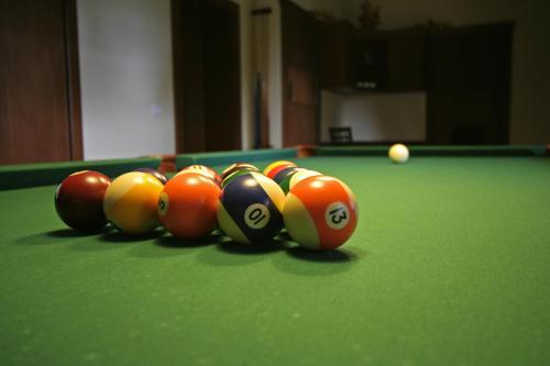 a group of billiard balls on a pool table at Penzión Ingrid in Štrbské Pleso