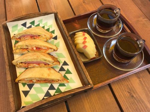 a tray of sandwiches and two cups of coffee at Gohyundang in Jeonju