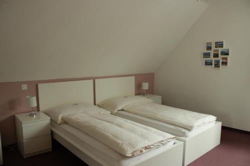 
Ein Bett oder Betten in einem Zimmer der Unterkunft Gasthof Metzg
