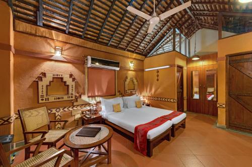 Кровать или кровати в номере Ibiza The Fern Resort & Spa, Kolkata
