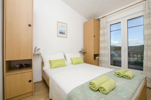 Ένα ή περισσότερα κρεβάτια σε δωμάτιο στο Apartments Zdenko