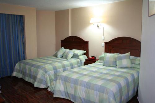 Katil atau katil-katil dalam bilik di Leo Hotel