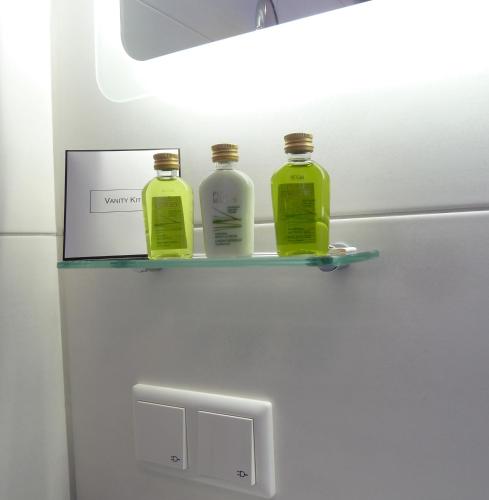 three bottles sitting on a shelf on a refrigerator at Hotel-Restaurant Goldenstedt in Delmenhorst
