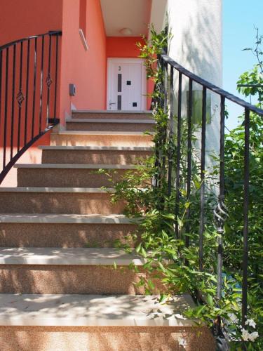 a set of stairs in front of a house at Villa Nada with garden, 80m from the beach in Vinišće