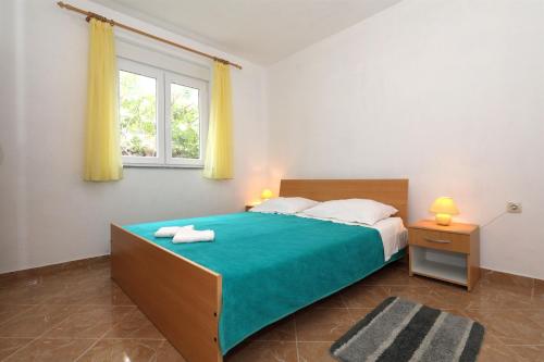 Posteľ alebo postele v izbe v ubytovaní Apartments Andelo II